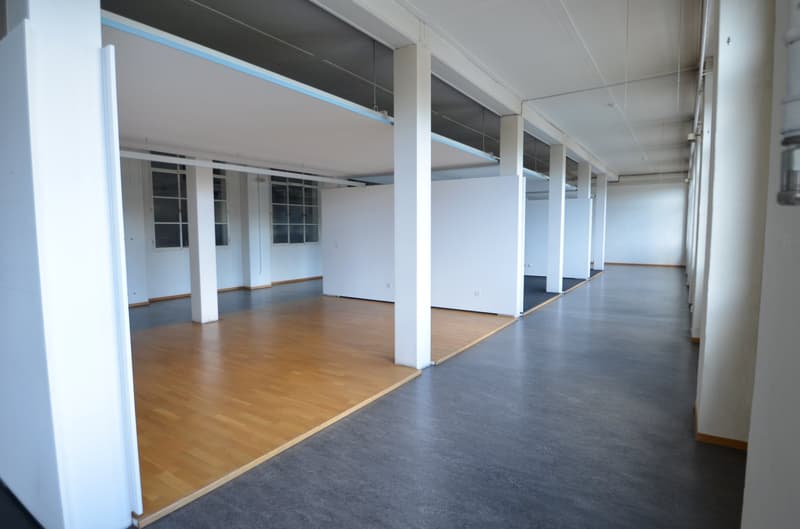 empty office room, wooden floors, gray floors, white walls, pillars, windows