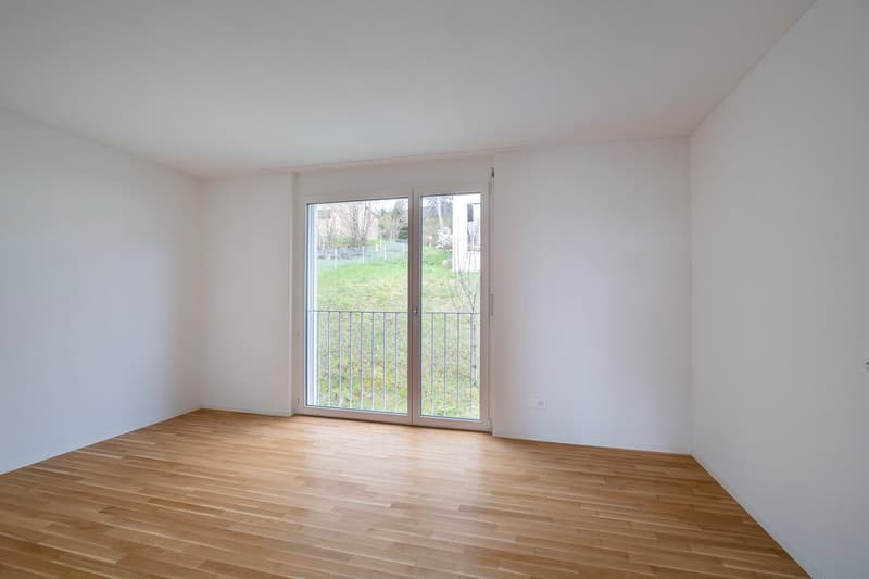 empty room, wooden floor, white walls, sliding glass door, balcony