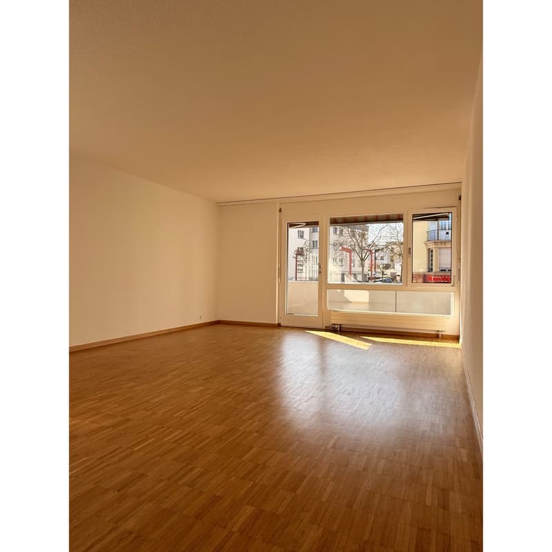 empty room, wooden floor, large windows, white walls