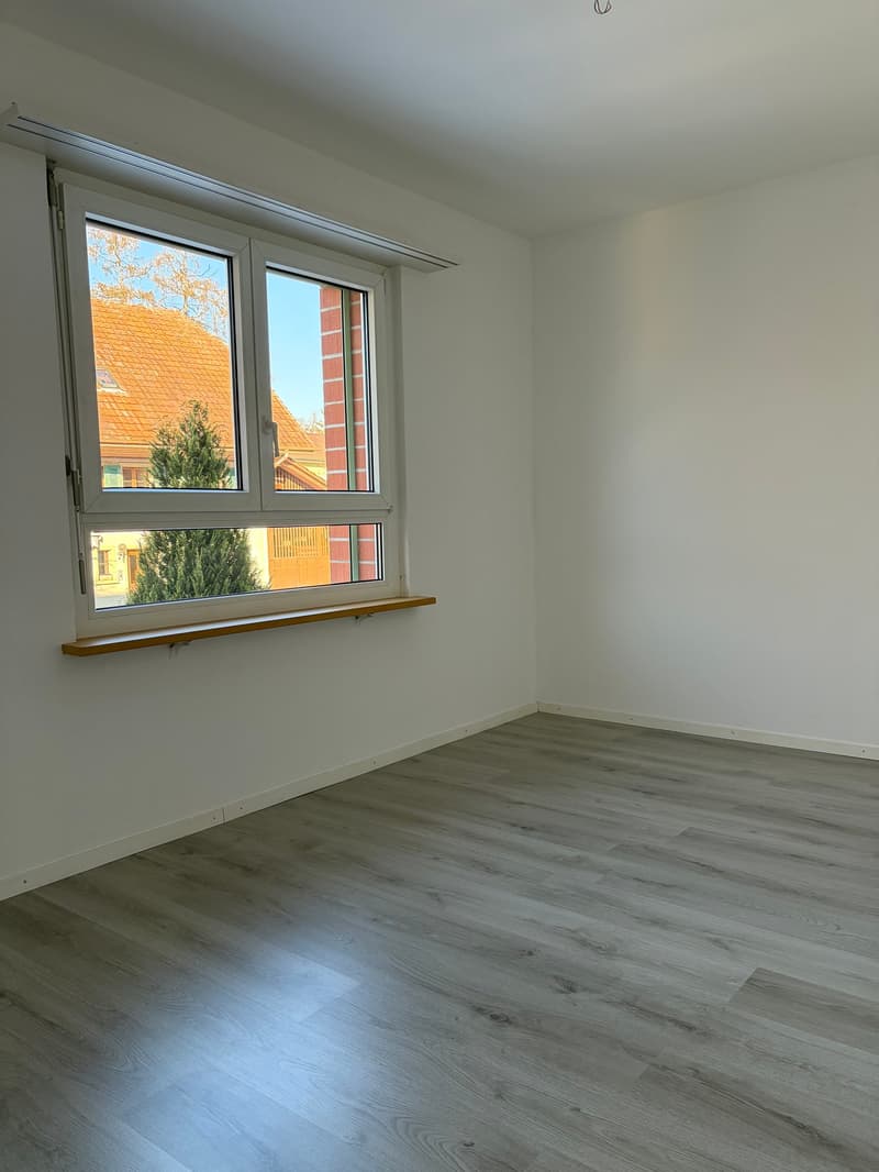 empty room, large window, wooden window sill, wooden floor, white walls