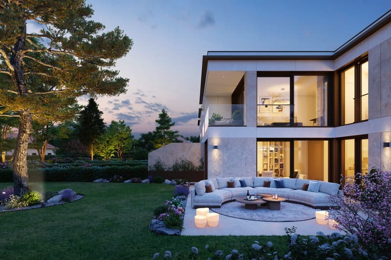 Modern two-story house with glass walls, balcony, outdoor seating area, and garden.