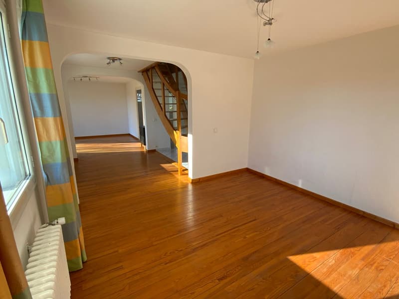 hardwood floors, white walls, wooden staircase, radiator, wooden ceiling beams, pendant lights
