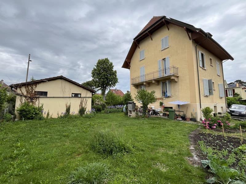 2 story house, balcony, garden, tree, green plants, grass, parked car