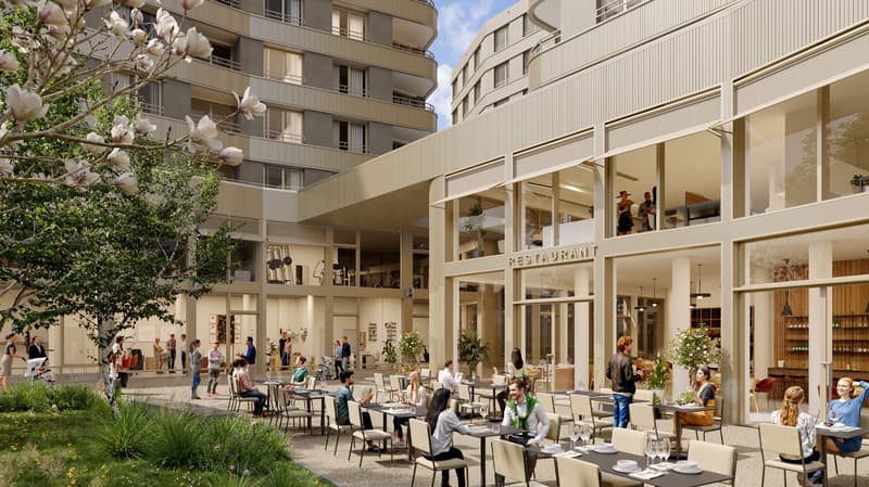 Outdoor dining area with tables and chairs, surrounded by apartment buildings, with a restaurant entrance visible