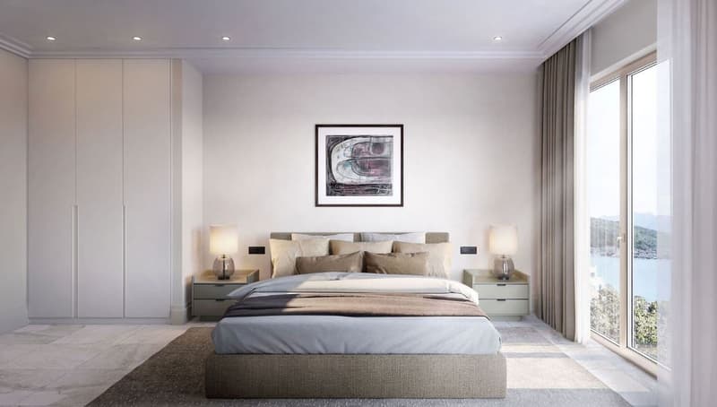 Spacious bedroom with large windows providing a scenic view, neutral color scheme with beige and gray tones, modern furniture including a king-size bed, nightstands, and built-in wardrobes, artwork on the wall above the bed