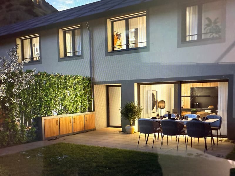 2 story house, gray walls, wooden doors, large windows, dining table with chairs in terrace, potted plants