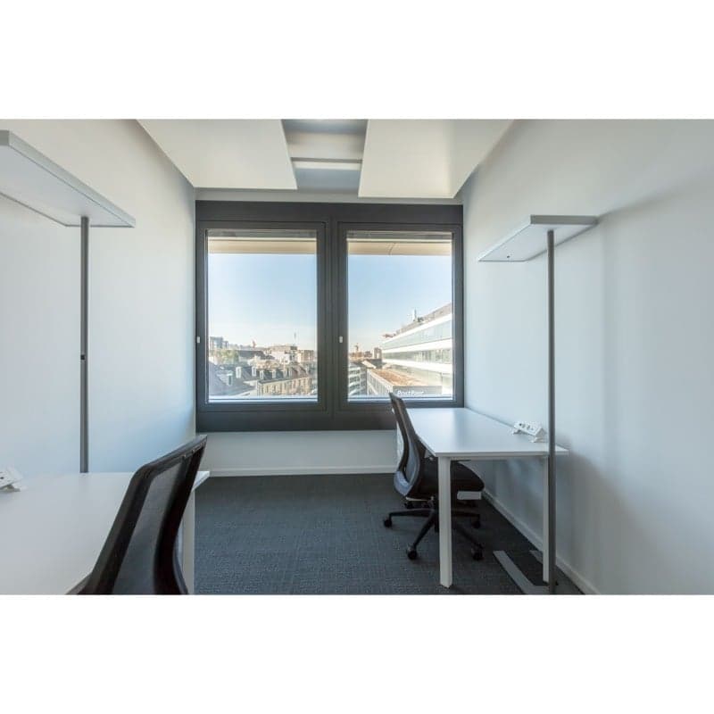 modern office room, white walls, two desks, black chairs, large window, city view