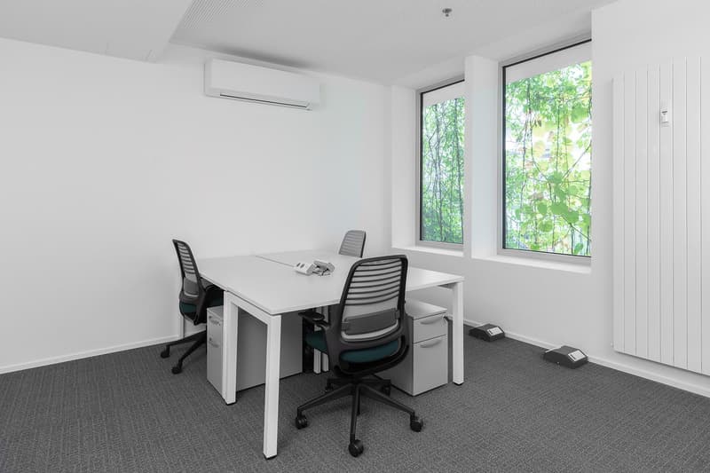 empty room, white walls, white desk, two chairs, two drawers, two windows, air conditioner, radiator