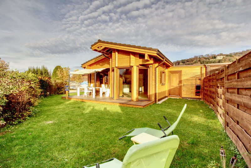 wooden house, terrace, garden, lawn, outdoor dining table and chairs