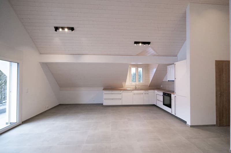 open kitchen, sliding glass door, white cabinets, light fixtures