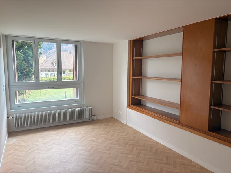 wooden floors, radiator, built-in shelves, double window, white walls