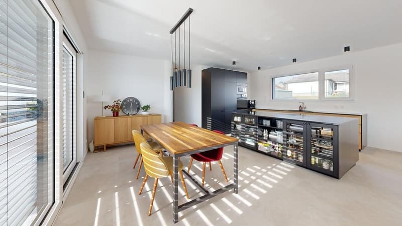 modern kitchen with dining area, wooden table, chairs, wooden cabinet, microwave, sink, windows, sliding glass doors