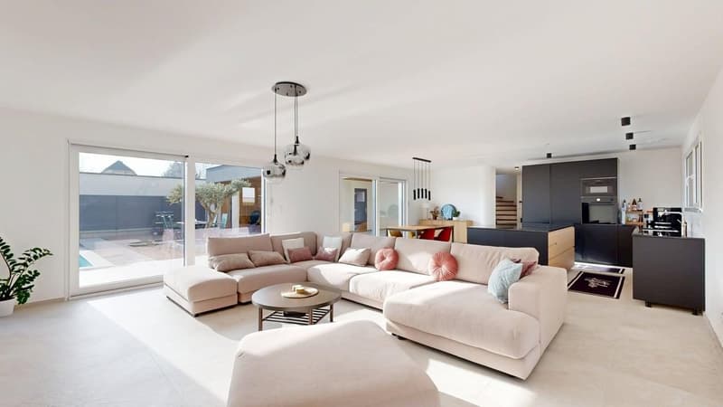 modern living room, beige sofa, round table, large windows