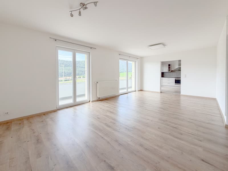 Espace de vie avec accès direct au balcon exposé Sud