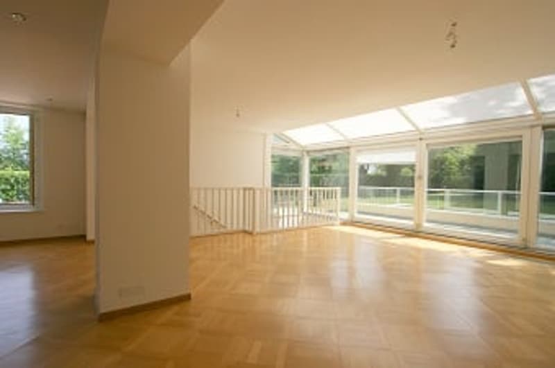 empty room with wooden floor, large windows and terrace