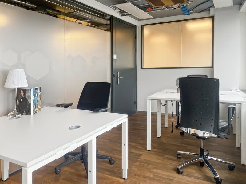 modern office, white walls, wooden floor, white desks, black chairs, lamp, glass partition, door