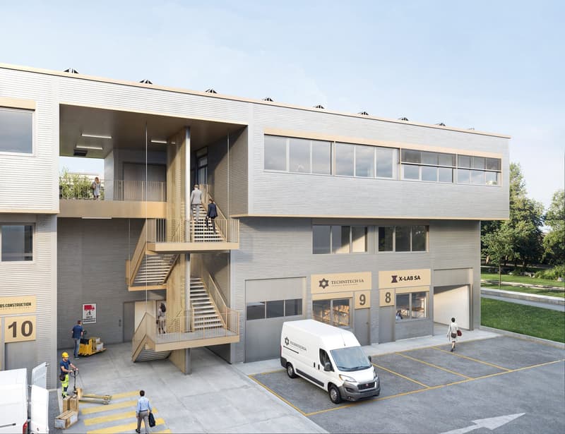 2-story commercial building with a modern, minimalist design. The building has large windows, a covered entrance, and an exterior staircase. There are several parking spaces in the front of the building, and construction workers are visible outside.