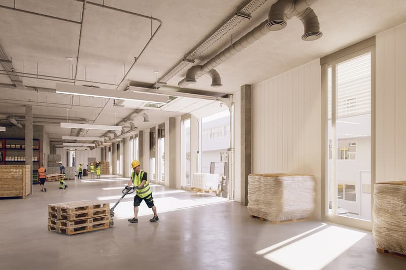 Spacious warehouse, high ceiling, large windows, concrete floor, workers using pallet jacks, wooden pallets, industrial ambiance.