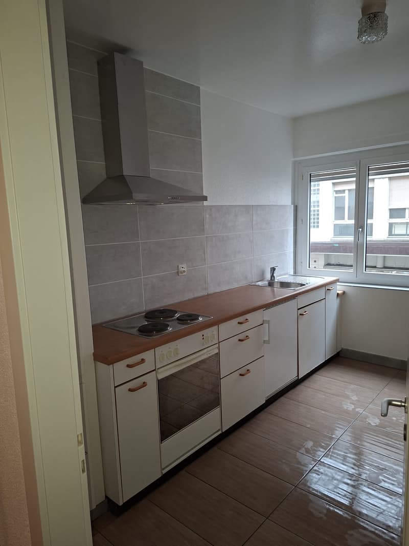 white cabinets, wooden countertop, oven, electric stove, sink, dishwasher, extractor fan, window