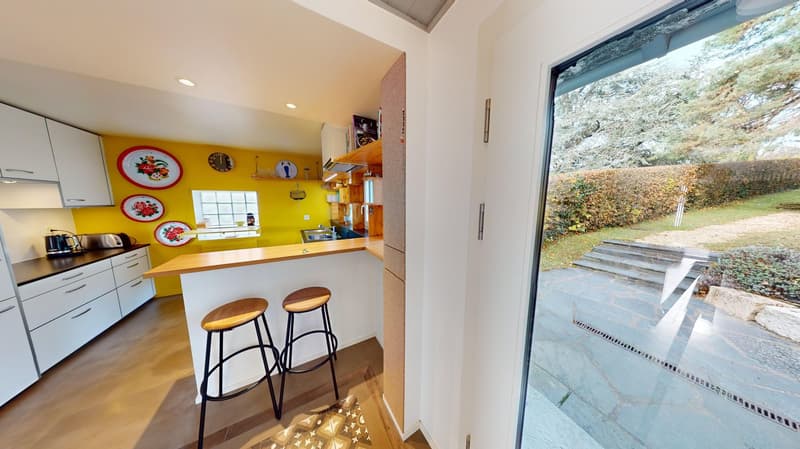yellow wall, wooden countertop, bar stools, window, glass door