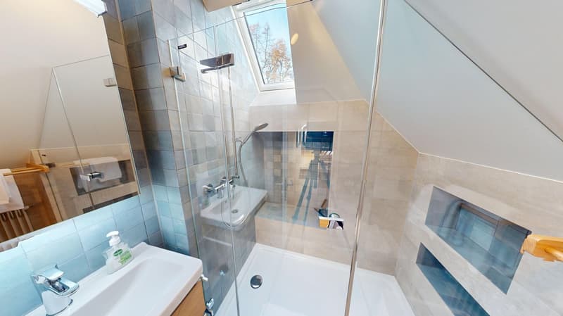 modern bathroom with glass walls, bathtub, shower, sink, mirror, tiled walls, skylight