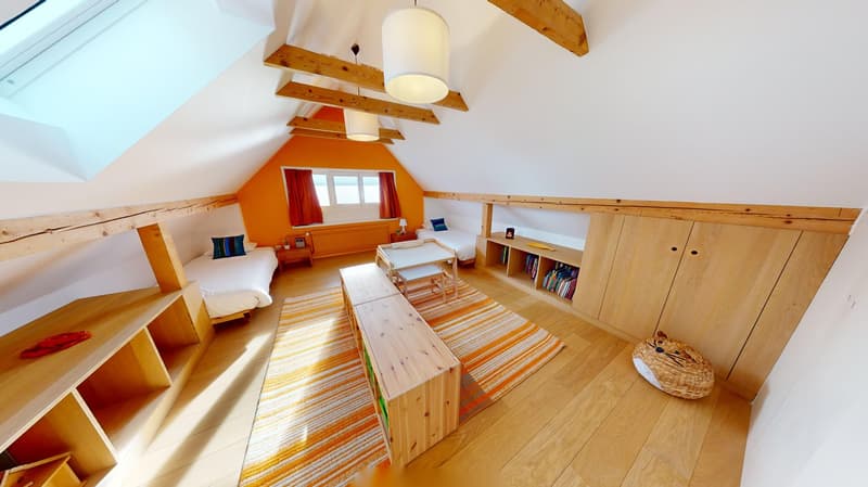 small children's room, hardwood floor, bright colors, wooden beds, lamps, wooden wardrobe, books, rug