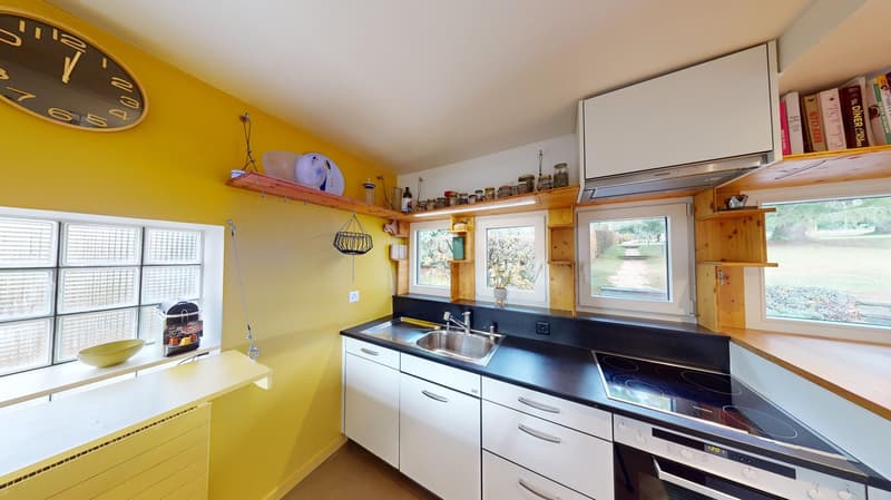 Modern kitchen, double sink, electric stove, oven, white cabinets, yellow walls, double window, large shelf