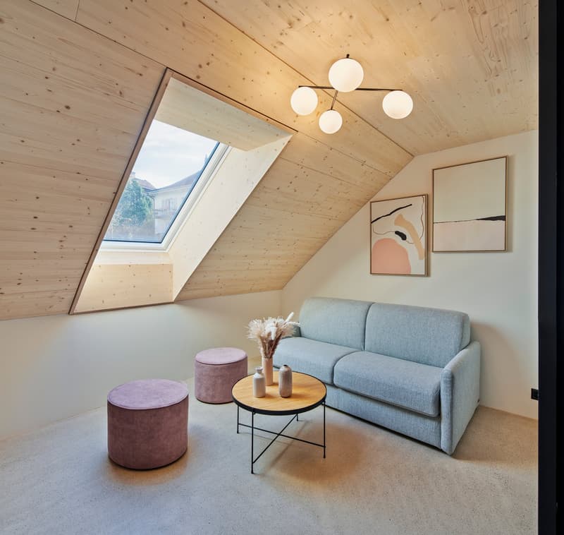 Cotton sofa, wooden table, purple ottomans, skylight