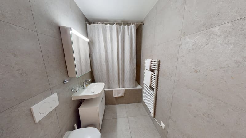 modern bathroom with white tiles, white sink, white shower curtain, bathtub, wall-mounted towel rack, white toilet