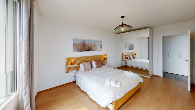 double bed, 2 nightstands, large mirror, large window