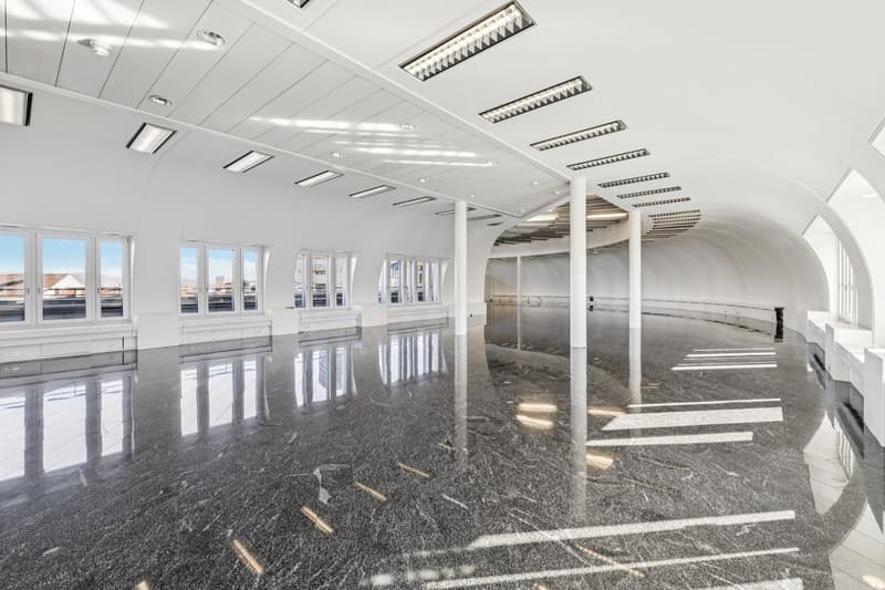 large open space, white ceiling, marble floors, large windows