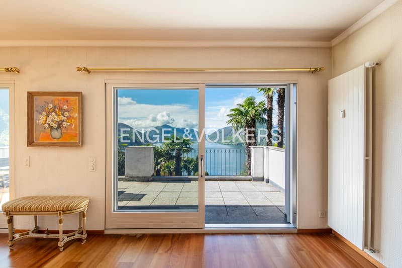 wood floor, sliding doors, balcony, painting on wall, bench, radiator, radiator