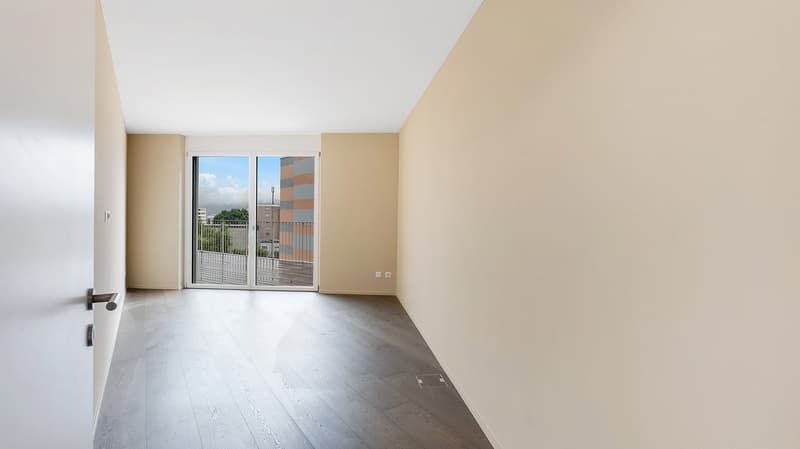 empty room, hardwood floors, sliding doors, balcony, light walls, power outlet