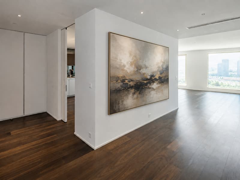 Der grosszügige Empfangsbereich überzeugt mit klarer Raumstruktur, edlen Materialien und urbanem Panorama.