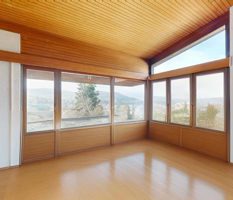 wooden ceiling, wooden flooring, large glass windows, view of the valley