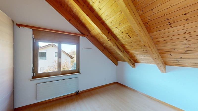 attic room, wooden floor, blue wall, white radiator, double window