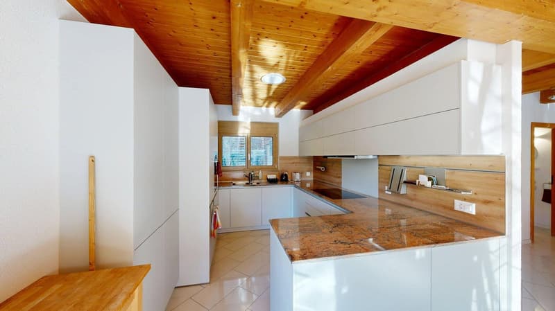 white cabinets, marble countertop, wooden beams, white tile floor, double sink, gas stove, ceiling lamp