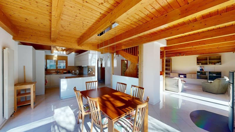 Open kitchen and dining area, modern kitchen, large wooden dining table, wooden floor, wooden beam ceiling