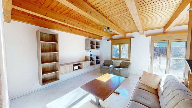 Wooden ceiling, white tiles, sofa, armchairs, wooden cabinet, table, white walls
