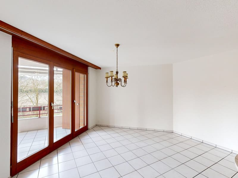 empty room, white tiles, chandelier, sliding glass doors, balcony