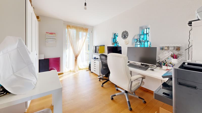 office room with desk, computer, printer, office chair, wooden floor, white walls