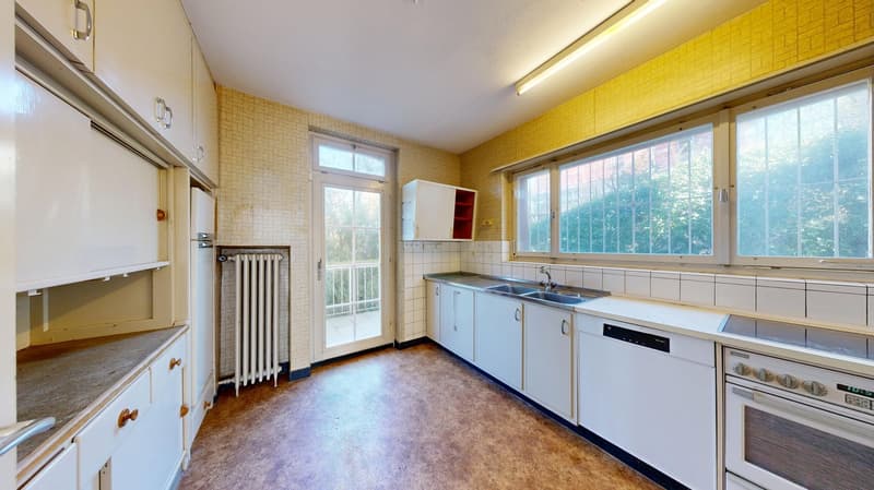 white cabinets, tiled walls, wooden floor, sink, dishwasher, oven, windows