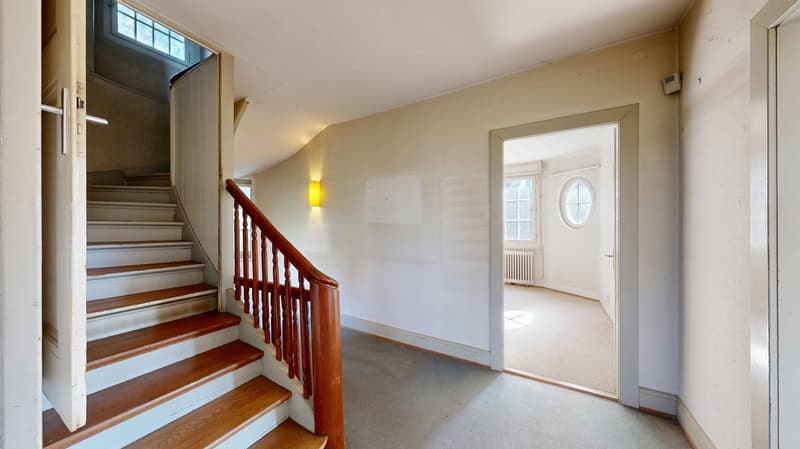 wooden staircase, white walls, wooden handrail, open door, window, radiator