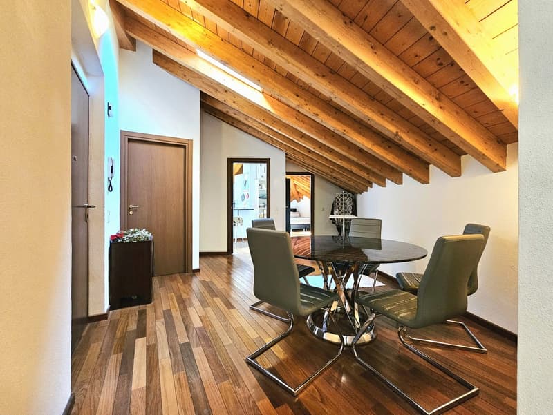 wooden flooring, wooden beamed ceiling, dining table with chairs, wooden wardrobe, indoor flower vase