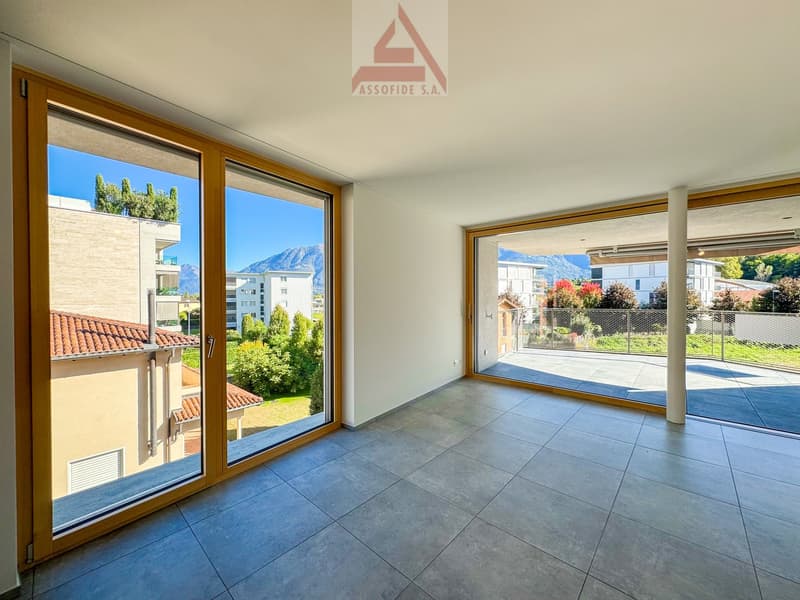 large glass doors, terrace, tiled floor, white walls, mountains view