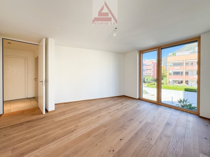 wooden floor, large windows, minimalist design, bright