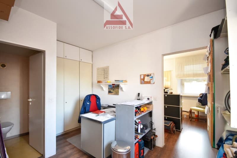 Office: desk, cabinet, chair, shelves, toilet
