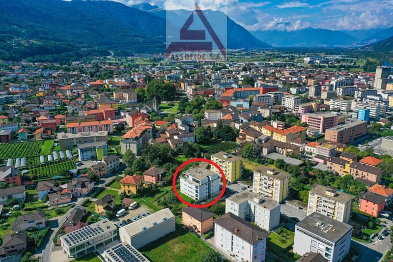 City center building, residential building, multiple floors, green areas