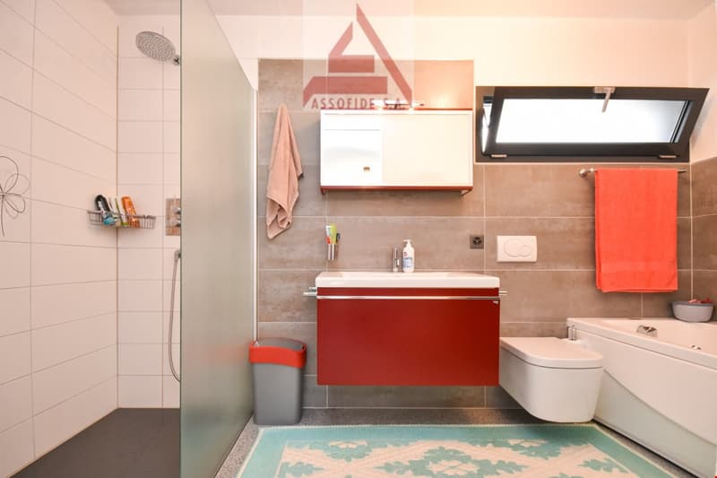 modern bathroom, walk-in shower, bathtub, sink, white fixtures, tiled walls and floor