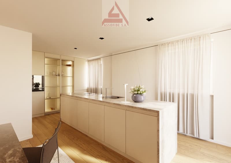 Modern kitchen with marble countertop, integrated sink, a faucet, a white flower vase, wooden floor, and neutral walls